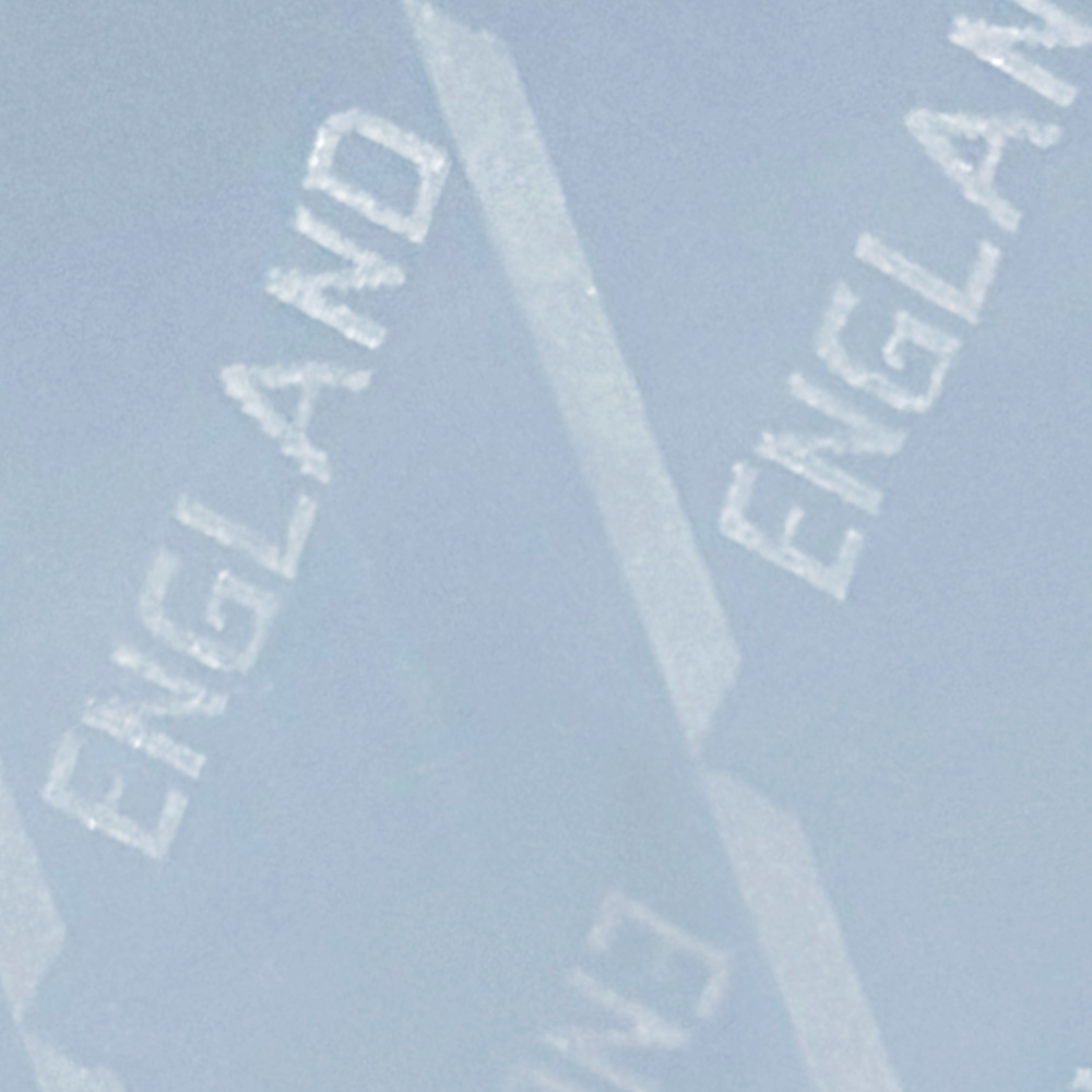 Close-up of a surface featuring the word 'England' repeated in a light pattern.